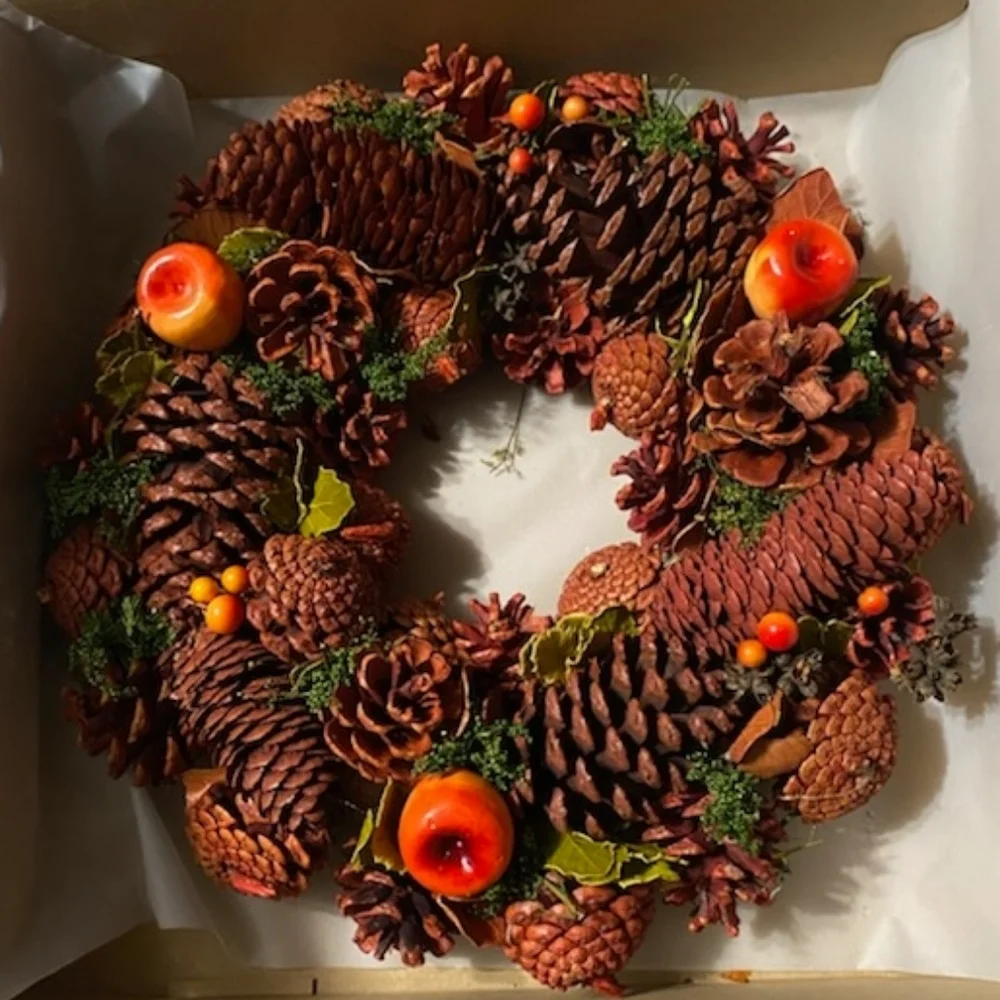 Rustic Pinecone Wreath with Red and Orange Accents
